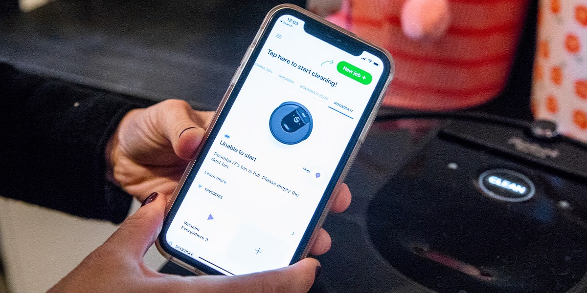Person uses iRobot Home app Person uses iRobot Home app