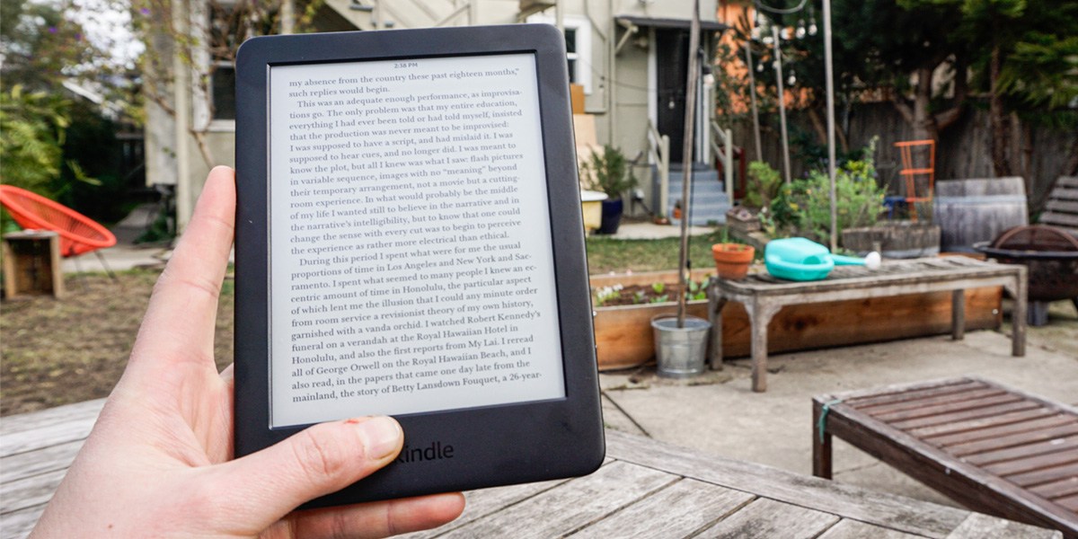 Hand holding Amazon Kindle E-Reader