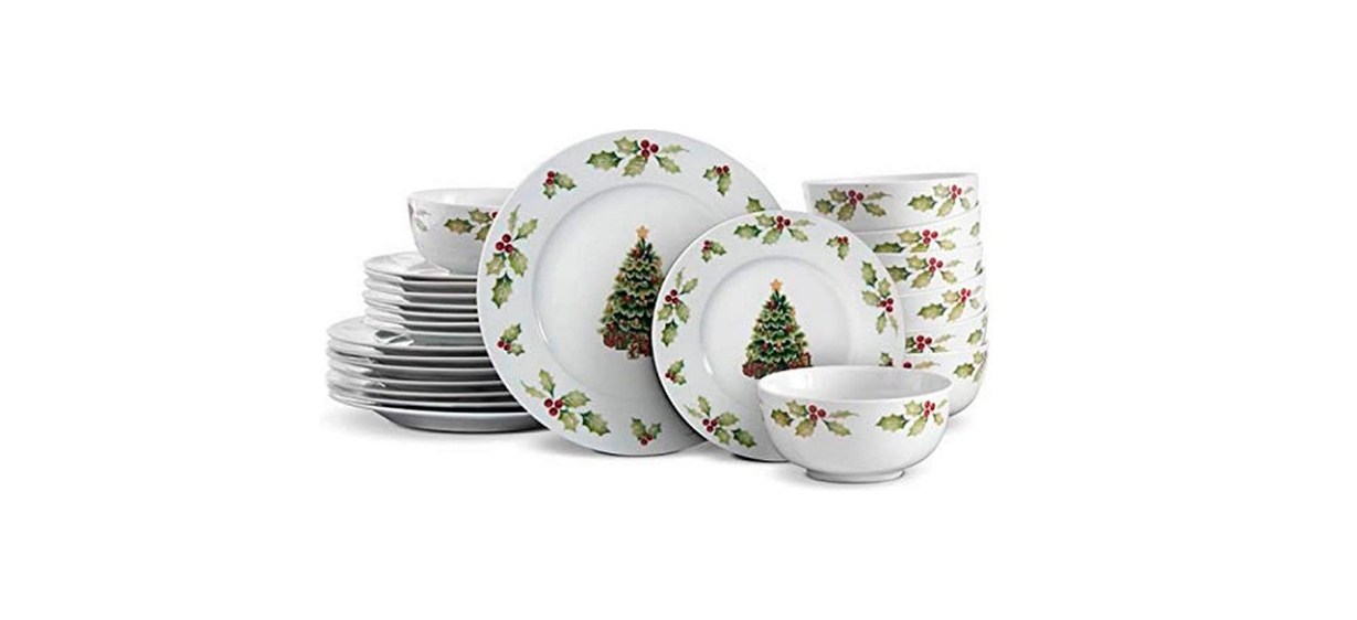 White plates and bowls with holly leaves on the borders and Christmas tree designs