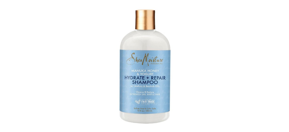 Blue bottle of SheaMoisture Shampoo on white background