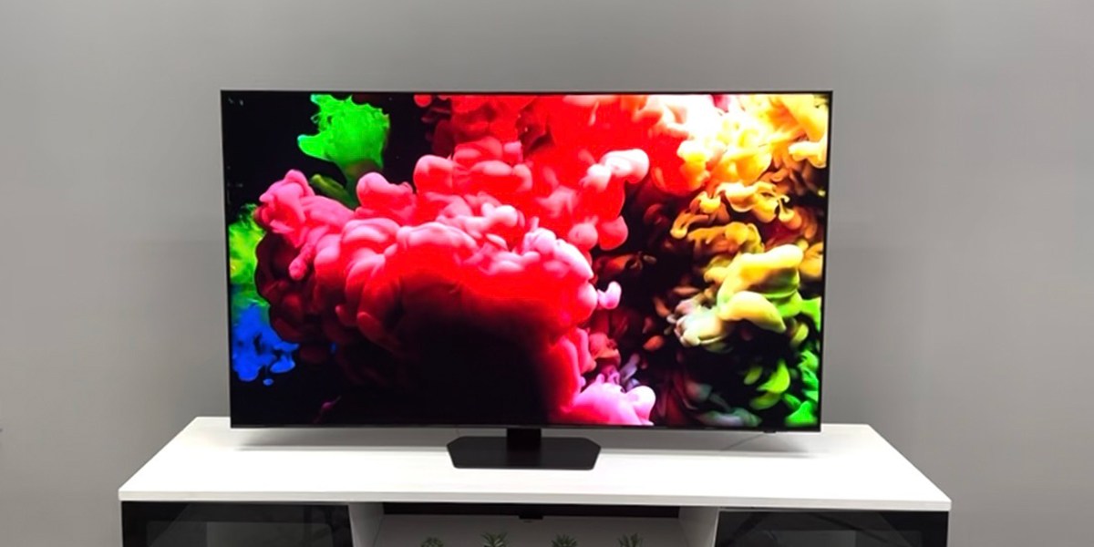 Samsung QN90D with colorful image on TV stand