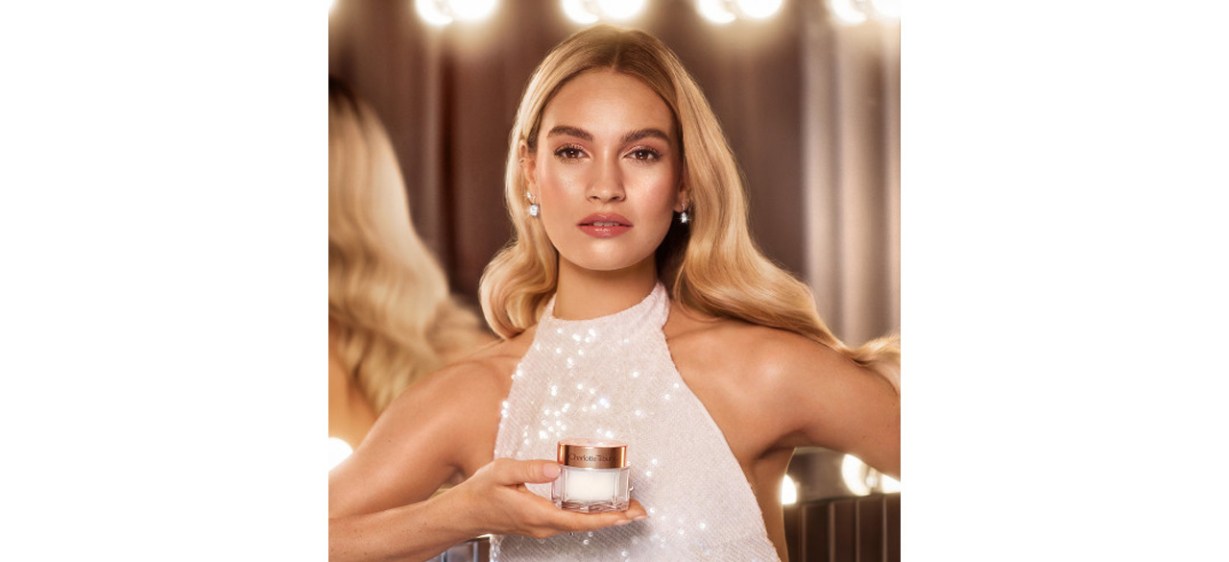 Woman holding jar of Charlotte Tilbury Magic Cream