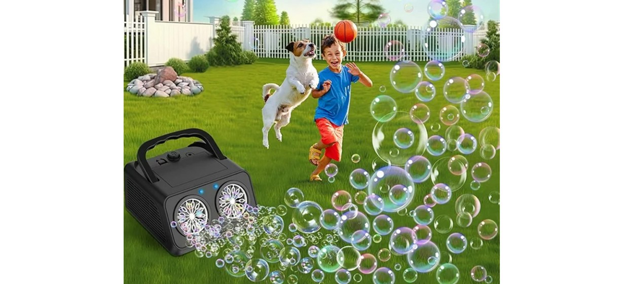 Bubble machine dispersing bubbles in yard while boy and dog play