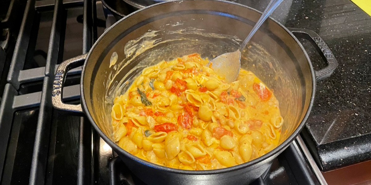Staub Cast Iron Dutch Oven with pasta dish and spoon inside