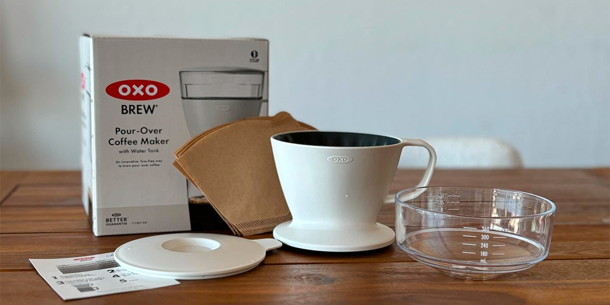 OXO Brew Single-Serve Pour-Over Coffee Maker on table in front of product box